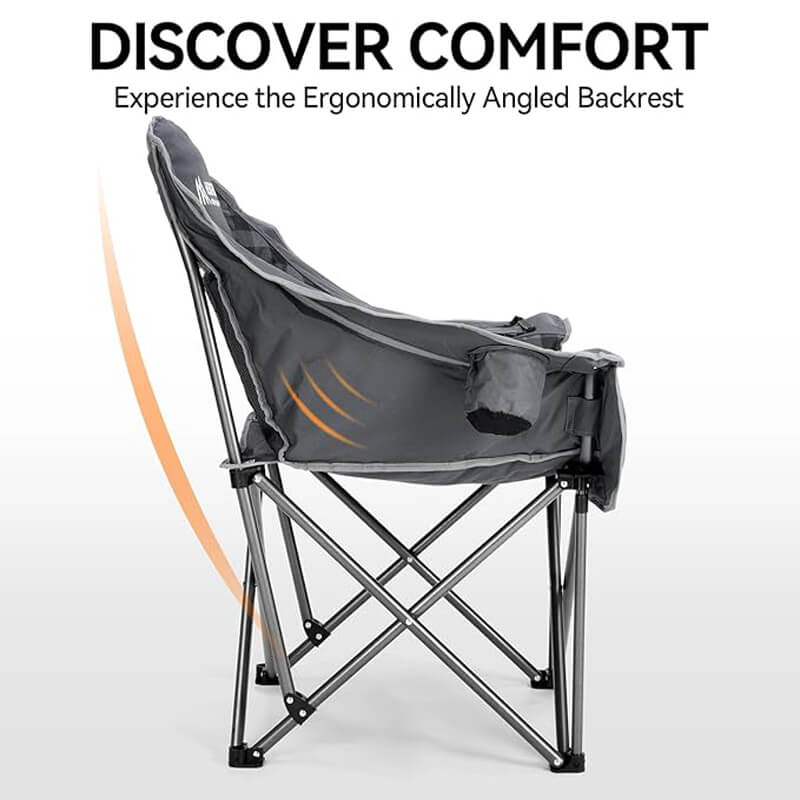 Side view of a black oversized folding camping chair highlighting its ergonomically angled backrest, designed for outdoor comfort, ideal for camping, hiking, and tailgating. Text overlay: "DISCOVER COMFORT - Experience the Ergonomically Angled Backrest"