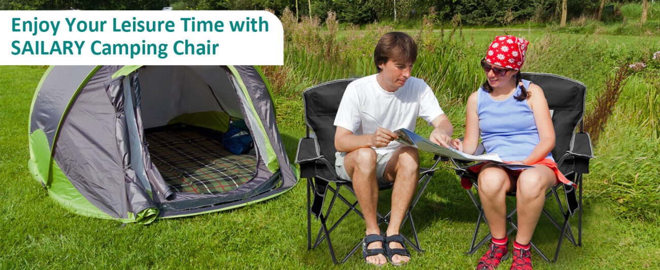Promotional image for SAILARY camping chairs, featuring a couple relaxing on black folding camping chairs in a lush grassy campsite, reading a map next to a green and gray tent. The text overlay "Enjoy Your Leisure Time with SAILARY Camping Chair" emphasizes outdoor comfort and leisure, ideal for users searching for couple-friendly, portable outdoor seating for camping and picnics